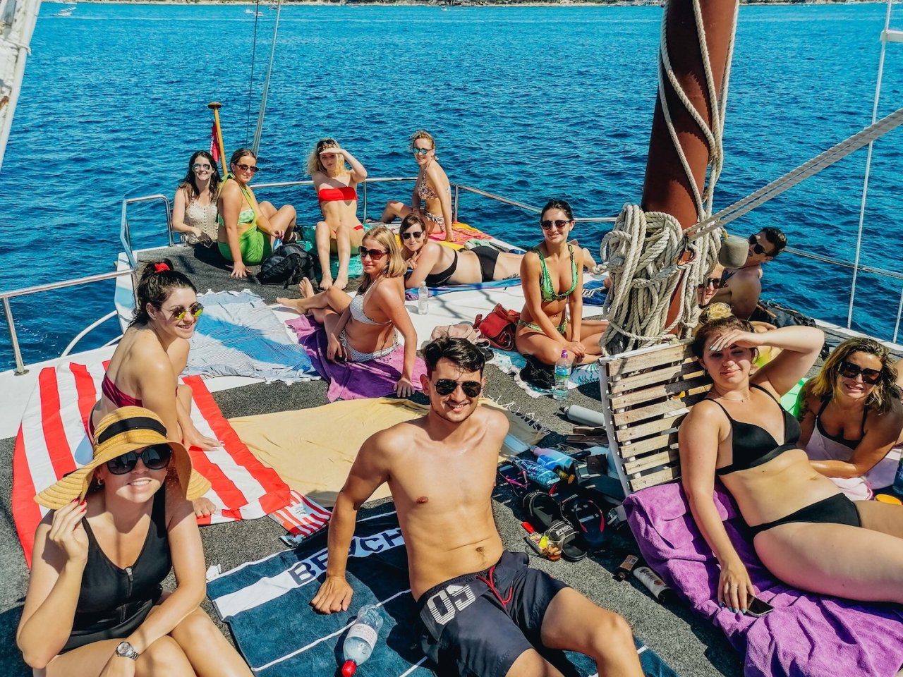 Group of people on upper deck of boat.