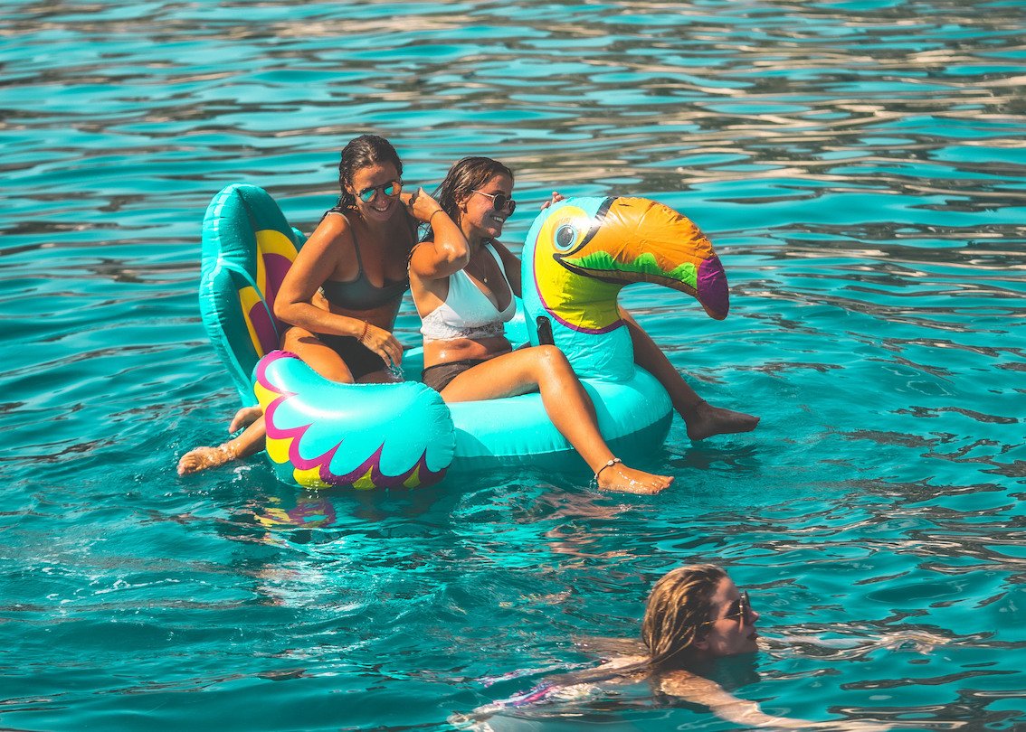 Pair on inflatable at Floatilla Party Croatia