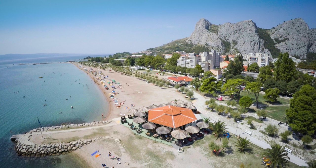 The beautiful coast of Omis, Croatia with mountains in the background