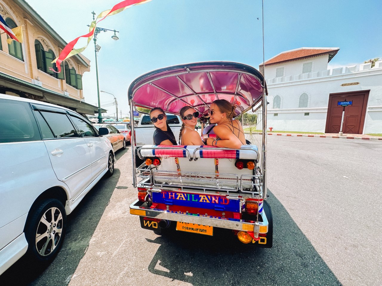 Group of solo backpackers in a tuktuk exploring Bangkok on Thailand Adventure with TruTravels 