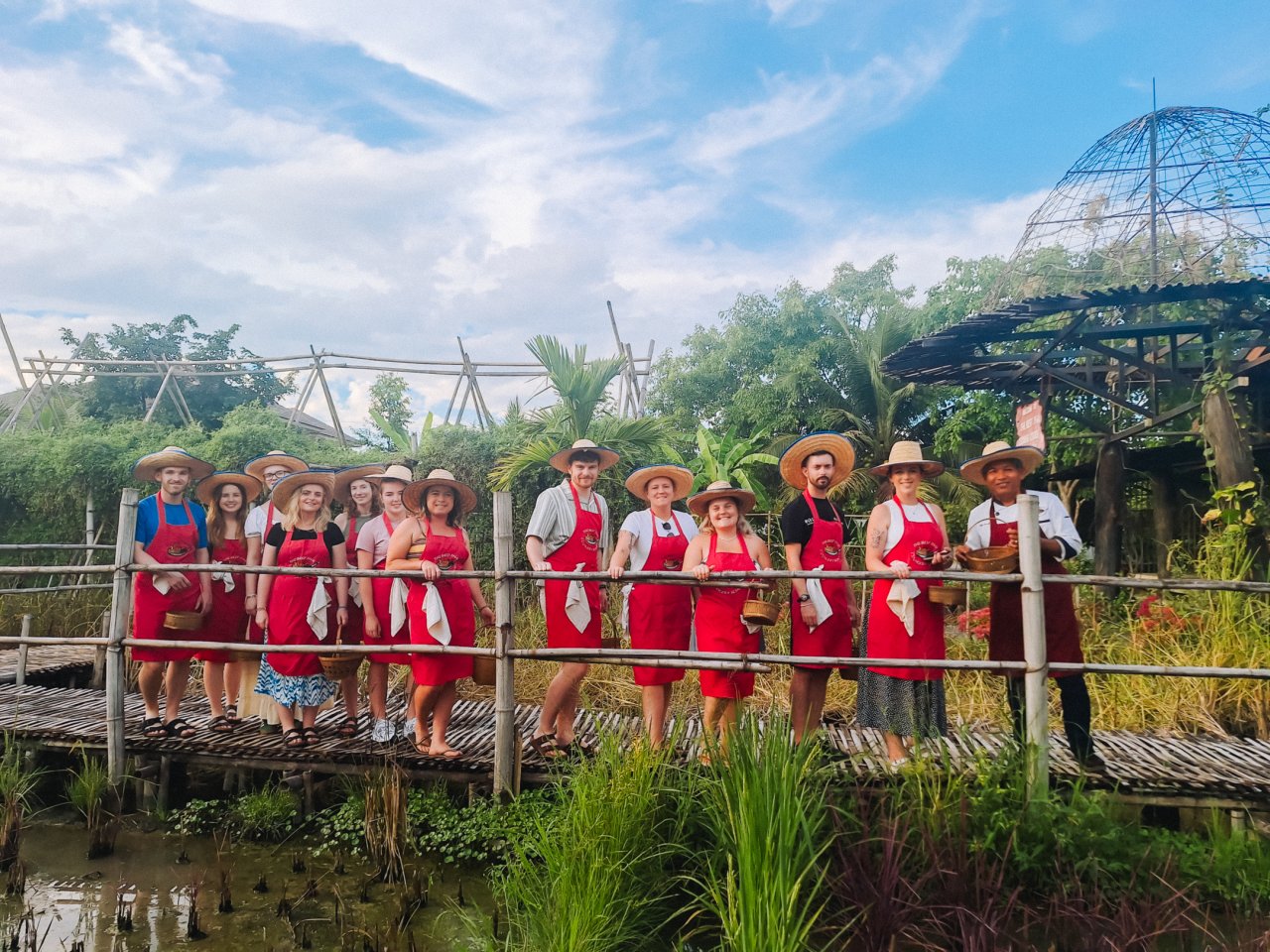Group of backpackers in Northern Thailand at an ethical elephant sanctuary 
