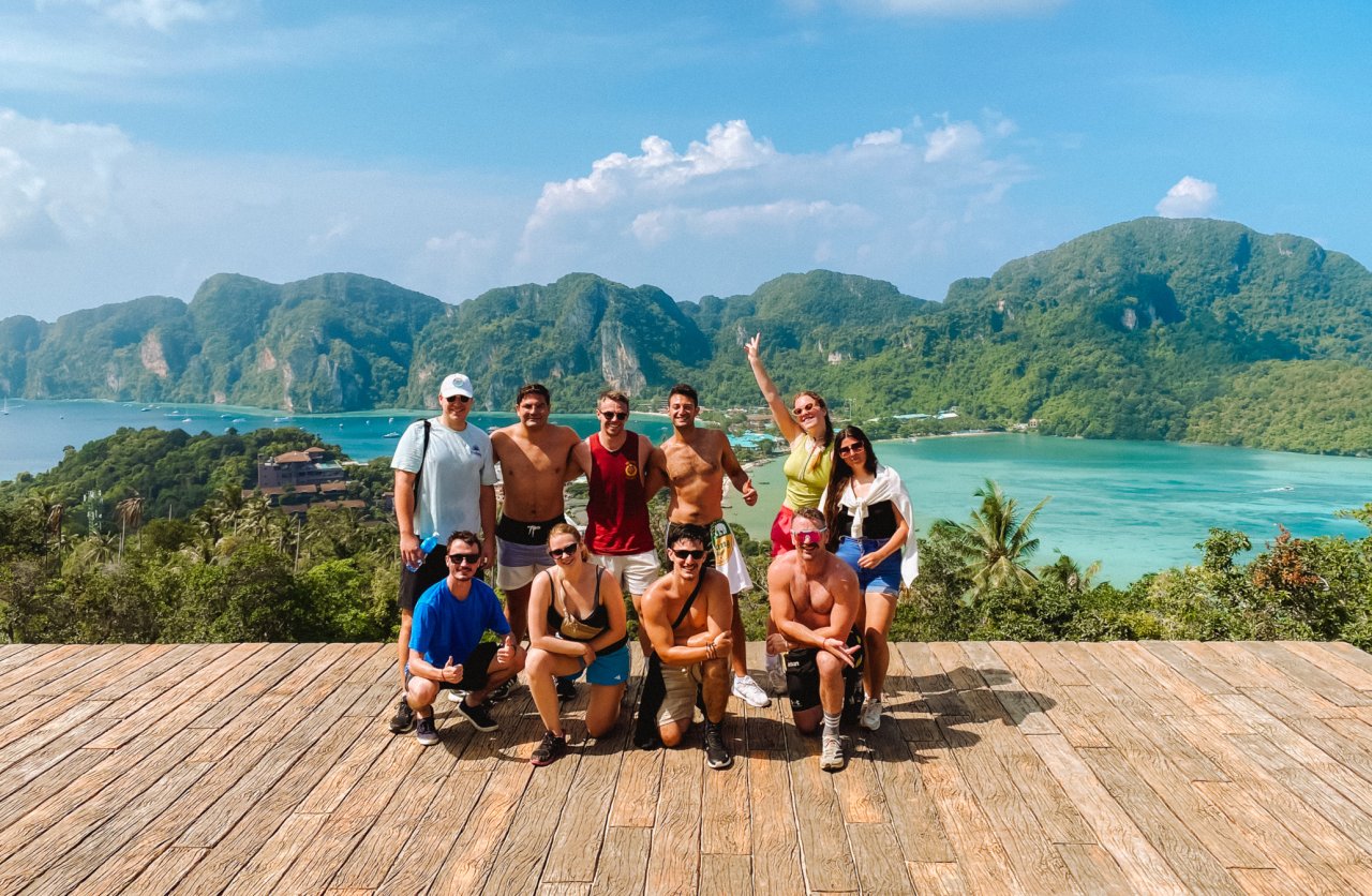 Group of young backpackers at the Phi Phi viewpoint in the North of Thailand